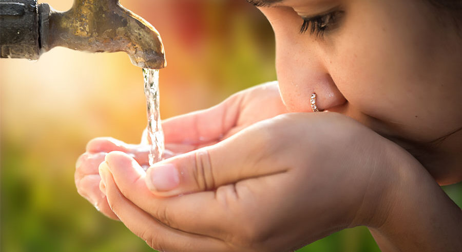 a woman drinks water
